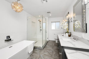 image of bathroom with wooden floors and marble countertops