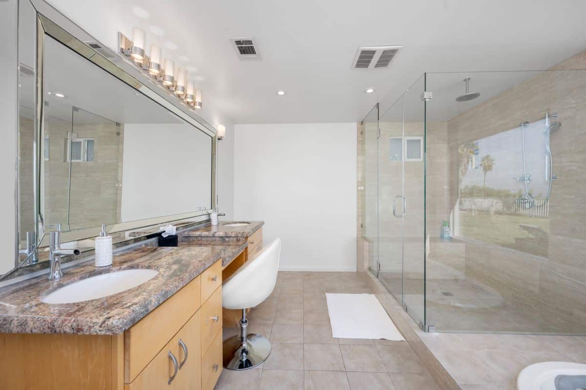 Blog 16 spacious white bathroom with stone countertop