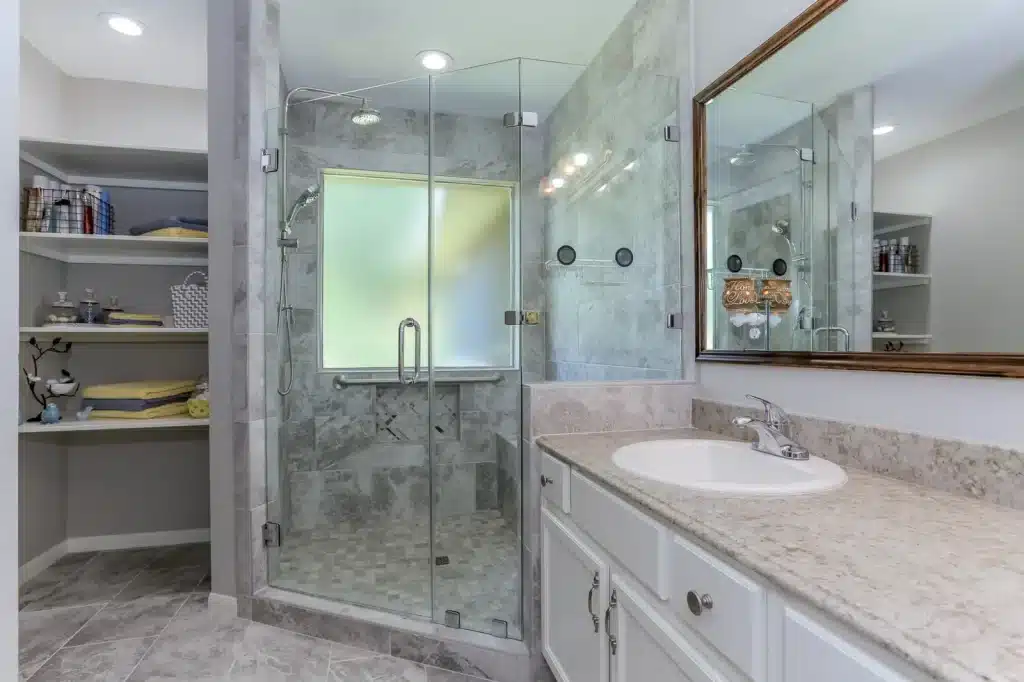 master bathroom remodel glass shower granite vanity open shelving houston tx